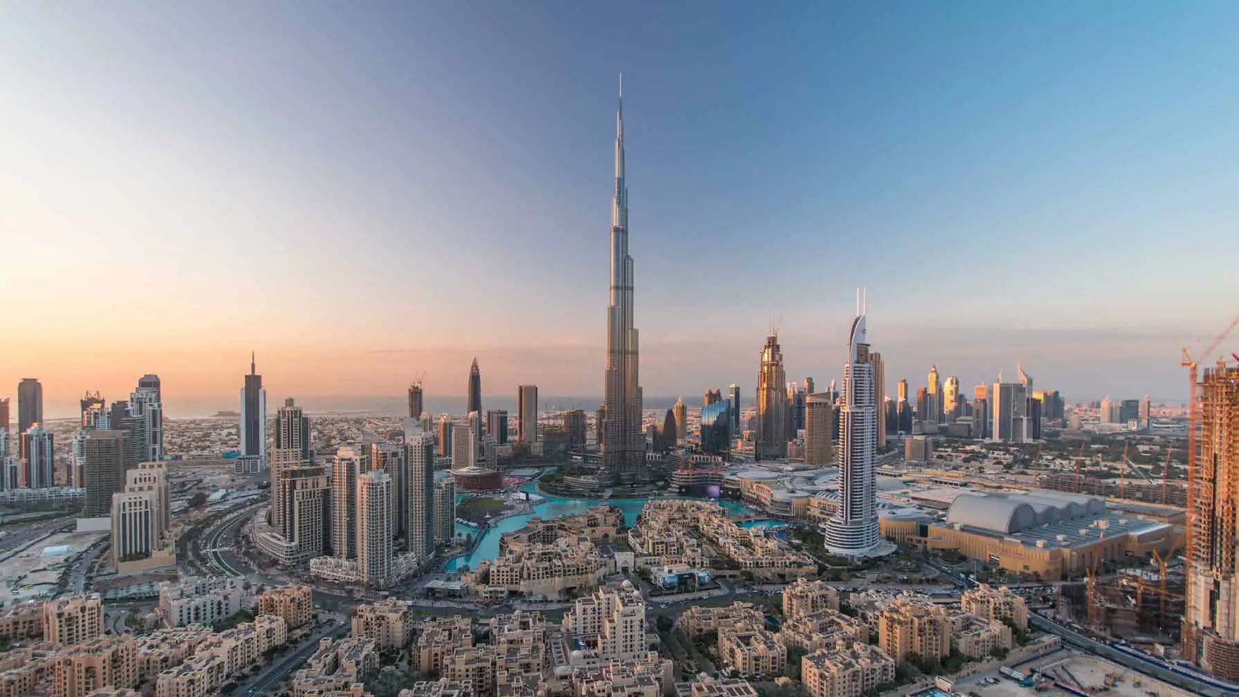 Downtown Dubai skyline with Burj Khalifa at sunset
